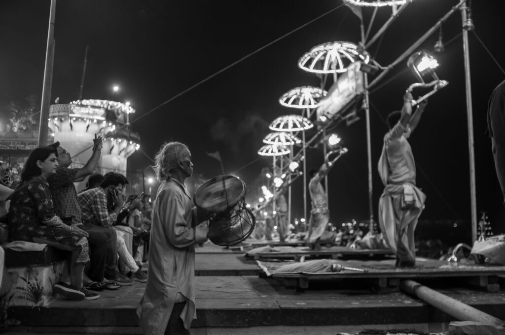 A captivating nighttime scene of Ganga Aarti at Dashashwamedh Ghat in Varanasi, India.