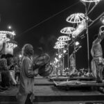 A captivating nighttime scene of Ganga Aarti at Dashashwamedh Ghat in Varanasi, India.