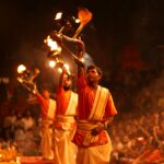 Priests perform the sacred Ganga Aarti ritual on the ghats of Varanasi, India.